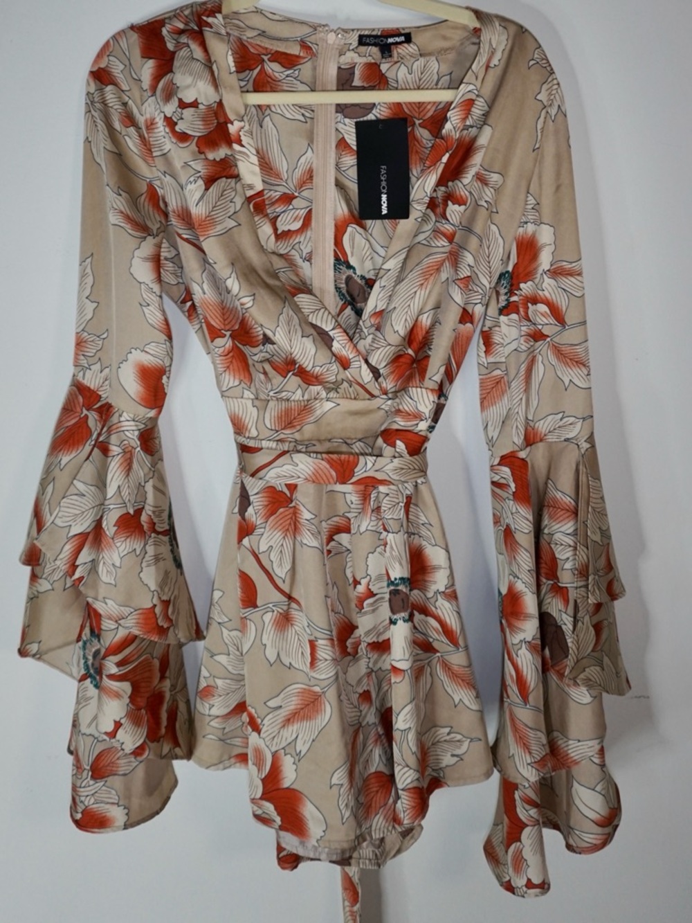 Fashion Nova Beige and Orange Floral Wrap Romper with Bell Sleeves
